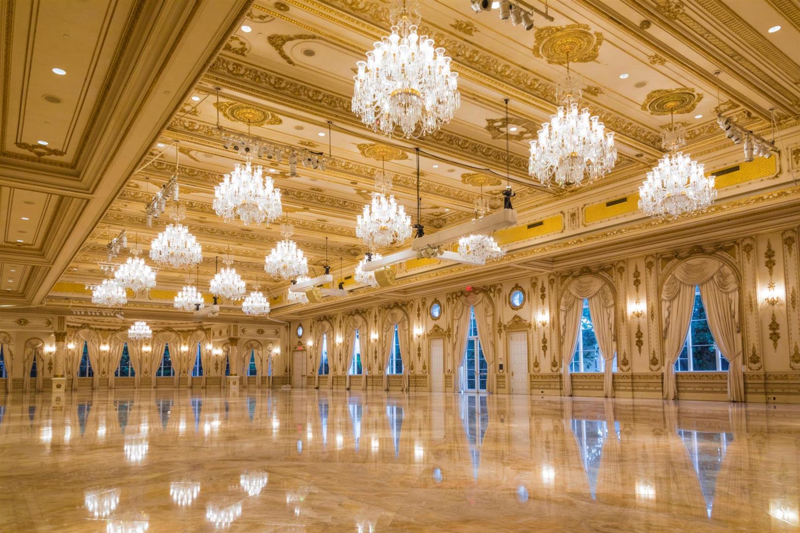 The Donald J. Trump Grand Ballroom at Mar-a-Lago, added in 2005: gilded ceilings, crystal chandeliers, and a polished marble floor.