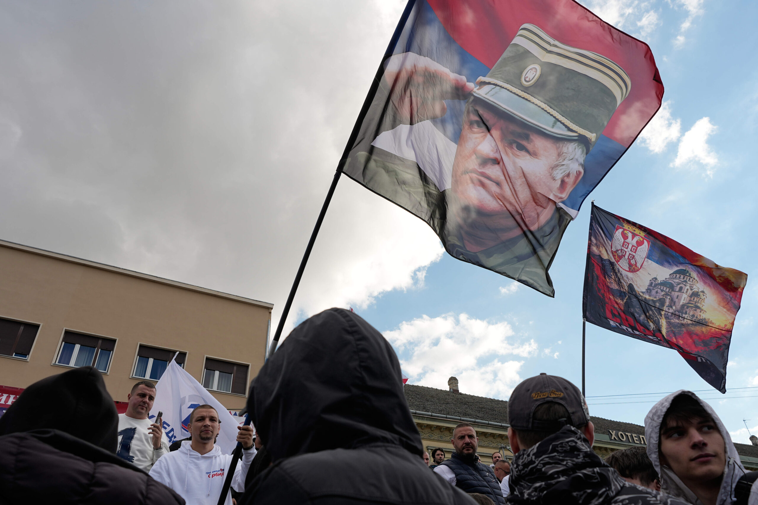 Other supporters display flags bearing Ratko Mladić’s image, nicknamed “the butcher of the Balkans.” © AP Photo/Darko Vojinovic
